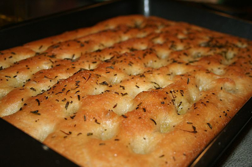 focaccia bread cooked to a golden brown in a pan